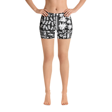 Women’s black and white Hawaiian SUP paddleboard shorts—four-way stretch microfiber, elastic waistband, vibrant print