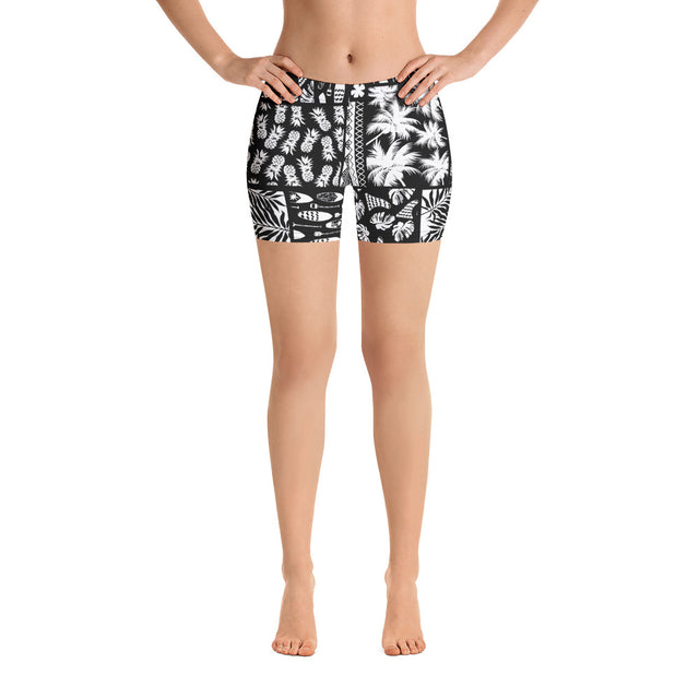 Women’s black and white Hawaiian SUP paddleboard shorts—four-way stretch microfiber, elastic waistband, vibrant print