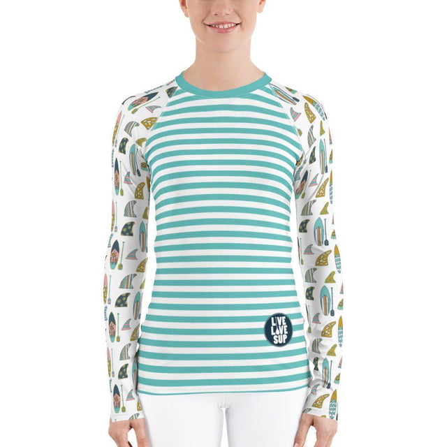 Long-sleeve women’s rashguard in turquoise with hand-drawn board and paddle stripes, offering UPF 38–40 protection, soft four-way stretch fabric, and a longer, ergonomic fit ideal for SUP.